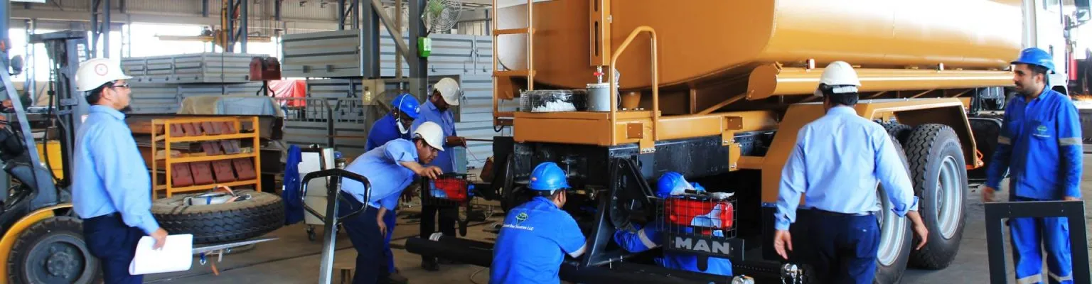 Team of engineers and technicians assembling a fuel tanker trailer at Diamond Steel Industries facility in the UAE